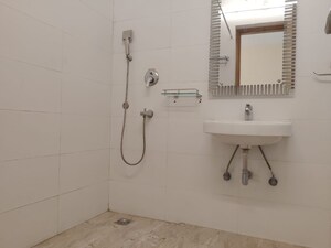 Bathroom in 4 BHK Apartment at Vasant Kunj – for Rent