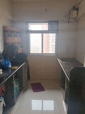 Team Area in 2 BHK Apartment at Glasswood Om Sarjan CHSL, Borivali West – for Sale