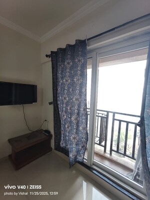 Living Room in 1 BHK Apartment at Raunak Bliss, Ghodbunder Road – for Rent
