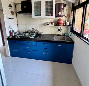 Kitchen in 1 BHK Apartment at Unnathi Woods Phase 3, Ghodbunder Road – for Sale