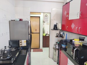 Kitchen in 2 BHK Apartment at Swaran Hans Tower, Morya Nagar – for Sale