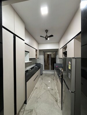 Kitchen in 3 BHK Apartment at Shrusti Saroj Sadan CHS, Naupada – for Rent