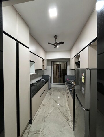 Kitchen in 3 BHK Apartment at Shrusti Saroj Sadan CHS, Naupada – for Rent