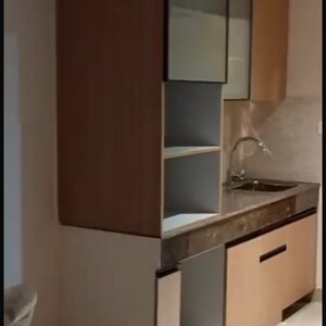 Kitchen in 1 BHK Apartment at Supertech Supernova Spira Suites, Sector 94 – for Sale