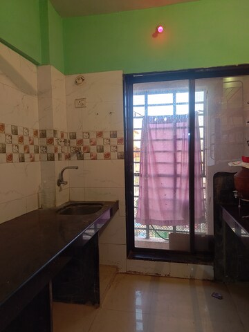 Living Room in 1 BHK Apartment at Mira Dharti Heights, Nalasopara West – for Rent