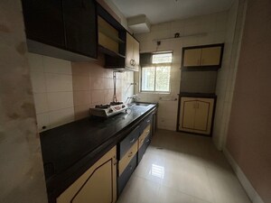 Kitchen in 2 BHK Apartment at Lalani Residency, Kavesar – for Rent