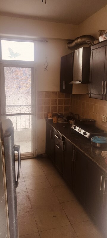 Kitchen in 2 BHK Apartment at Amrapali Empire, Sain Vihar – for Sale