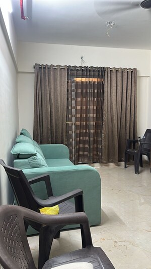 Living Room in 1 BHK Apartment at Lodha Amara, Kolshet Road – for Rent