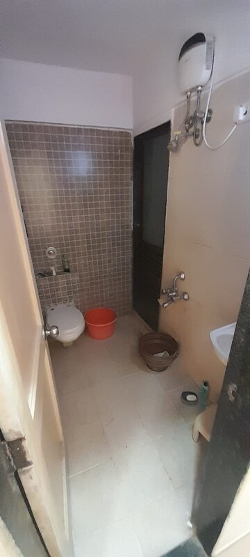 Bathroom in 2 BHK Apartment at Tarangan Towers, Samata Nagar – for Rent