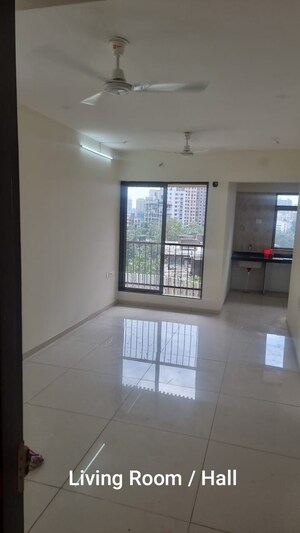 Living Room in 1 BHK Apartment at Dimple 19 North, Kandivali West – for Rent