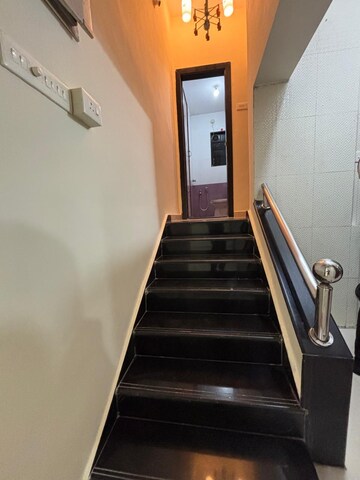 Staircase in 2 BHK Apartment at Badri Kedar Building, Seawoods Sector 40 – for Rent