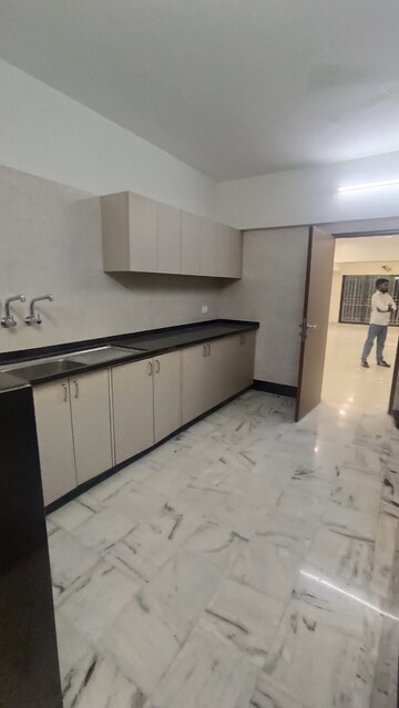Kitchen in 3 BHK Apartment at Mighty Manjushree Apartment, Vile Parle West – for Rent