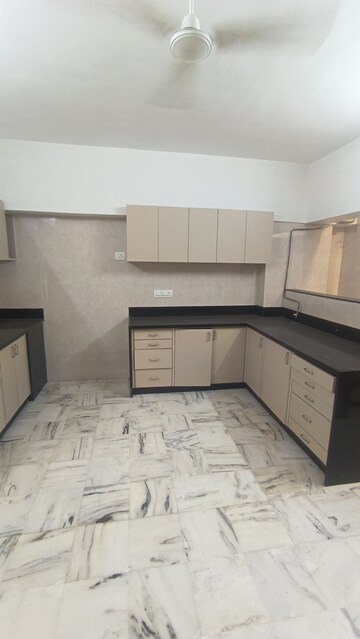 Kitchen in 3 BHK Apartment at Mighty Manjushree Apartment, Vile Parle West – for Rent