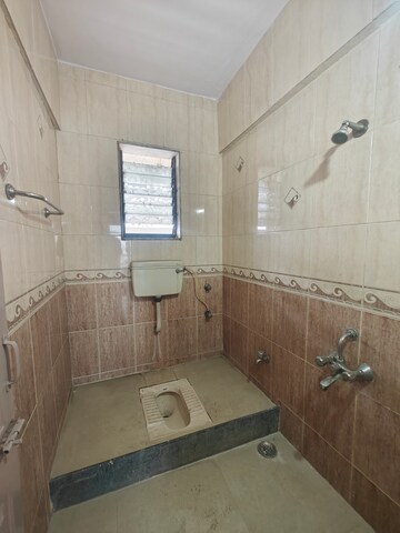 Bathroom in 2 BHK Apartment at Nandidham CHS, Seawoods – for Rent
