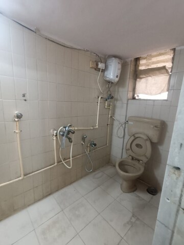 Bathroom in 1 BHK Apartment at New Jay Palace, Yari Road – for Rent