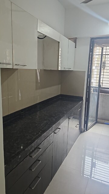 Kitchen in 1 BHK Apartment at Lodha Palava Downtown, Dombivli East – for Sale
