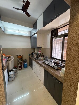 Kitchen in 2 BHK Apartment at Raunak Unnathi Woods Phase 6, Ghodbunder Road – for Sale