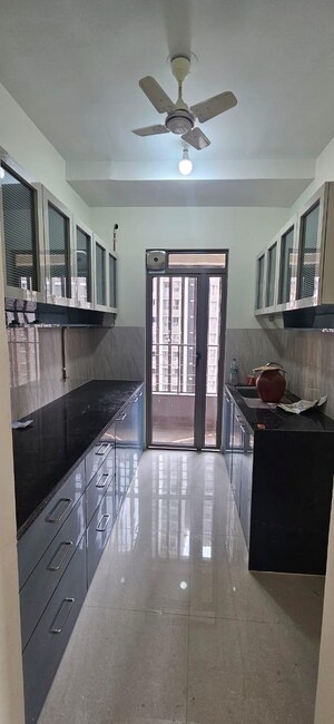 Kitchen in 2 BHK Apartment at Piramal Vaikunth, Balkum Pada – for Rent