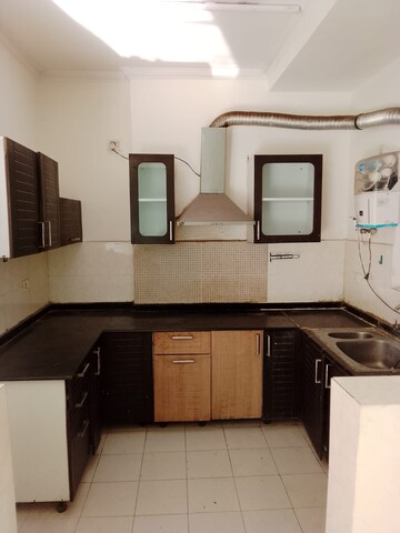 Kitchen in 2.5 BHK Apartment at Amrapali Princely Estate, Sector 76 – for Sale