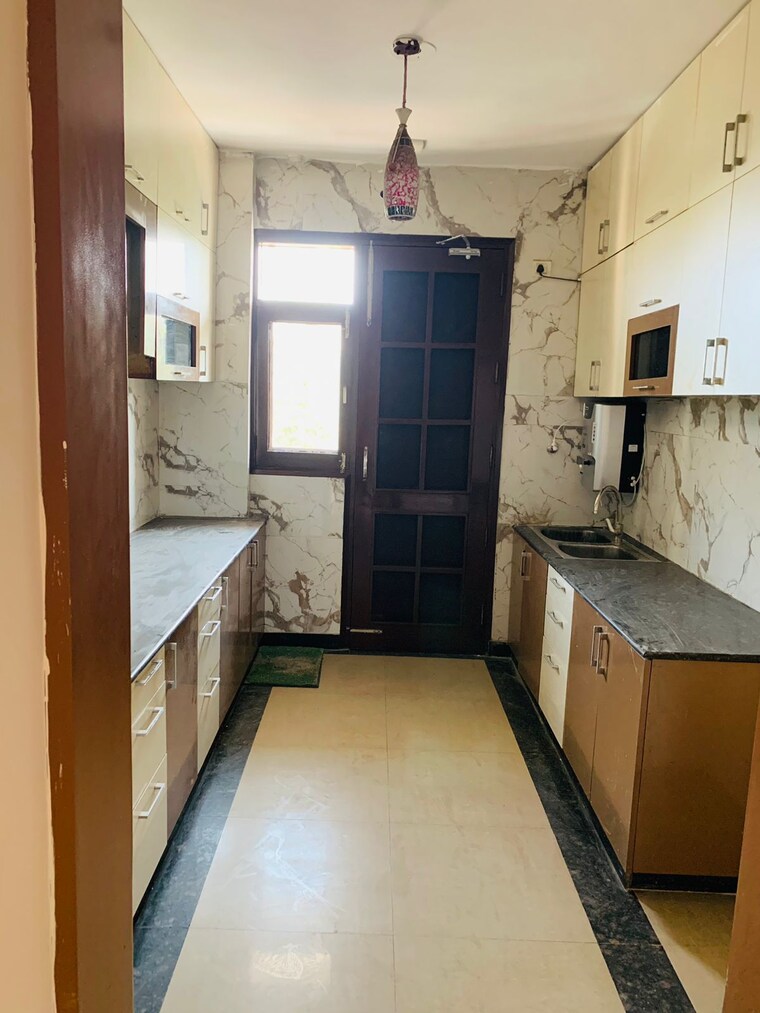 Kitchen, bollywood-esencia 4 Bedroom 2020 Sq.Ft. Apartment In Ghazipur Zirakpur 9531500