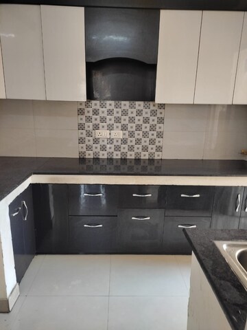 Kitchen in 2 BHK Apartment at Ajnara Homes, Sector 16b Greater Noida – for Rent