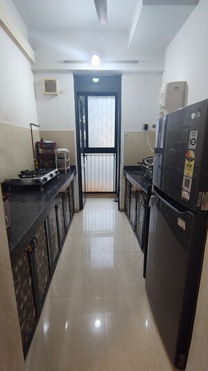 Kitchen in 1.5 BHK Apartment at Lodha Palava City Lakeshore Greens, Dombivli East – for Rent