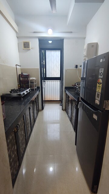 Kitchen in 1.5 BHK Apartment at Lodha Palava City Lakeshore Greens, Dombivli East – for Rent