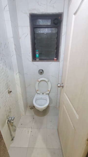 Bathroom in 1 BHK Apartment at Lok Upvan I, Manpada – for Rent