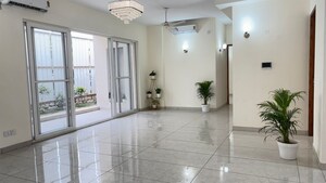 Living Room in 3 BHK Apartment at Amrapali Leisure Park, Amrapali Leisure Valley – for Sale