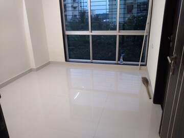Room in 1 BHK Apartment at Ajmera Boulevard, Malad West – for Rent