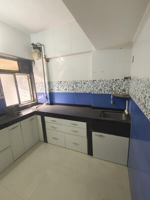 Kitchen in 1 BHK Apartment at Himgiri Lokupvan Phase II CHS Ltd, Vasant Vihar – for Rent