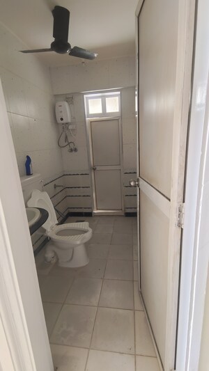 Bathroom in 2 BHK Apartment at Jasmine Tower, Vasant Vihar – for Rent