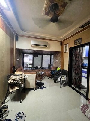 Living Room in 1 BHK Apartment at Gokuldham Complex, Goregaon East – for Rent