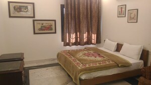 Bedroom in 4 BHK Builder Floor at Safdarjung Enclave – for Rent