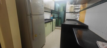 Kitchen in 2 BHK Apartment at Dedhia Palatial Height, Powai – for Rent