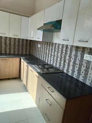 Kitchen in 4 BHK Builder Floor at Ansal API Esencia, Sector 67 – for Rent