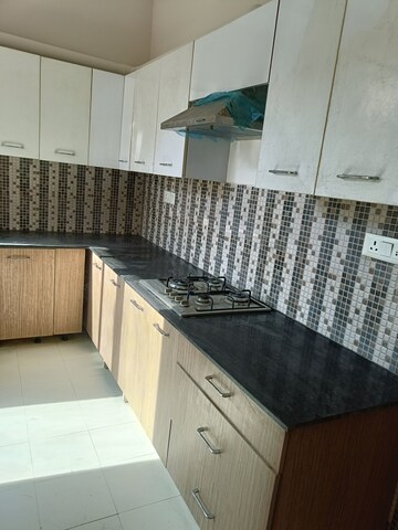 Kitchen in 4 BHK Builder Floor at Ansal API Esencia, Sector 67 – for Rent