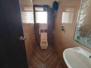 Bathroom in 2 BHK Apartment at Saaga Shri Sai Vishram CHS Ltd, Dahisar West – for Rent