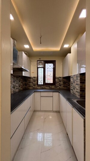 Kitchen in 4 BHK Apartment at Niti Khand – for Sale