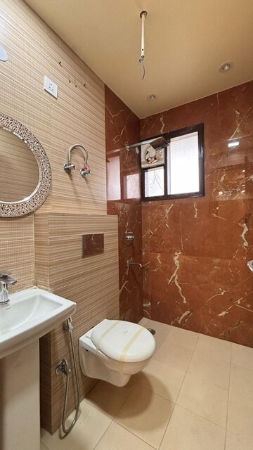 Bathroom in 4 BHK Apartment at Niti Khand – for Sale