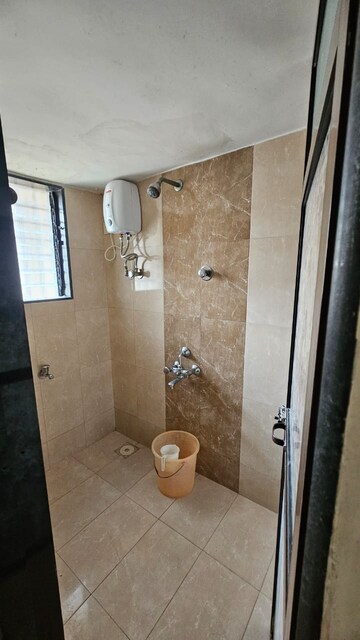 Bathroom in 1 BHK Apartment at Soni Palace CHS, Borivali West – for Rent