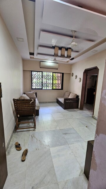 Living Room in 1 BHK Apartment at Soni Palace CHS, Borivali West – for Rent