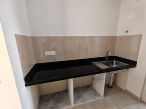 Kitchen in 2 BHK Apartment at Courtyard by Narang Realty and The Wadhwa Group, Pokhran Road No Two – for Rent