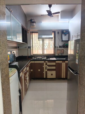 Kitchen in 2 BHK Apartment at Palash Towers, Andheri West – for Rent