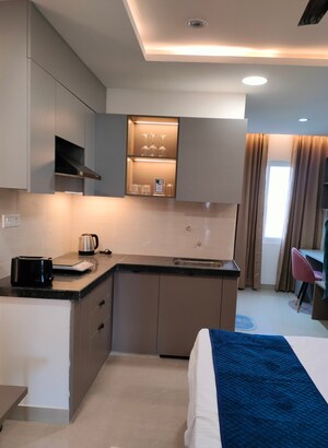 Kitchen in Studio Apartment at Okay Plus Solitaire Suites, Ramnagariya – for Rent