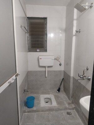 Bathroom in 3 BHK Apartment at Vidyut Apartment, Sector 12 Dwarka – for Rent