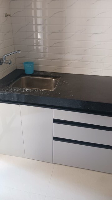 Kitchen in 1 BHK Apartment at Paradigm Zenith Pushpanjali Residency Phase III, Ghodbunder Road – for Rent
