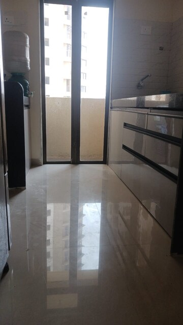 Kitchen in 1 BHK Apartment at Paradigm Zenith Pushpanjali Residency Phase III, Ghodbunder Road – for Rent