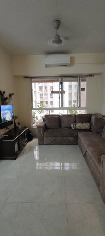 Living Room in 1 BHK Apartment at Lodha Amara, Kolshet Road – for Sale