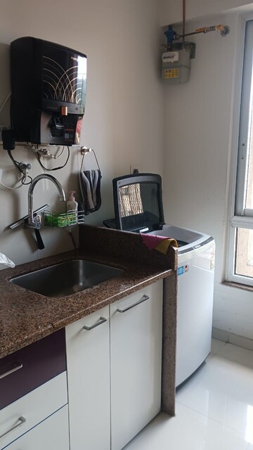 Kitchen in 2 BHK Apartment at Puranik Rumah Bali, Ghodbunder Road – for Rent